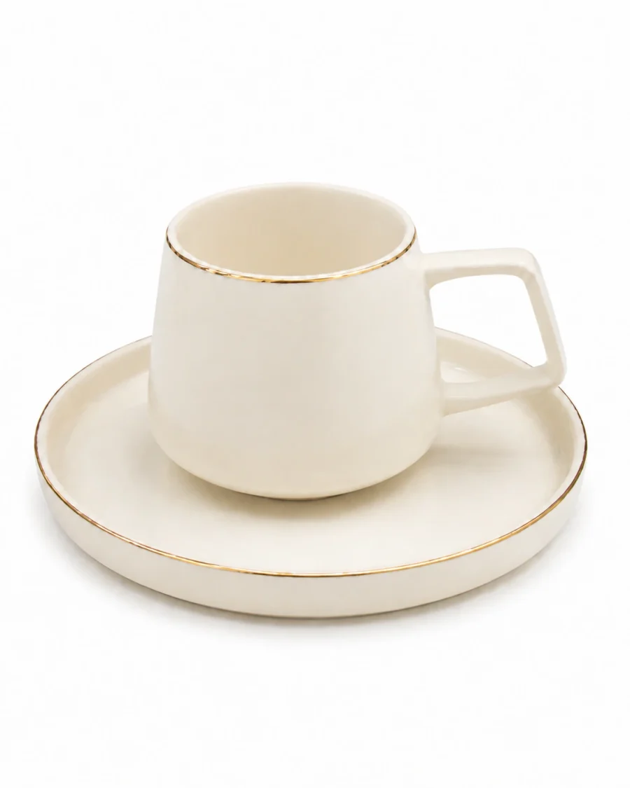 Linea ivory angular handle cup and gold rim saucer on a #FEFEFE background