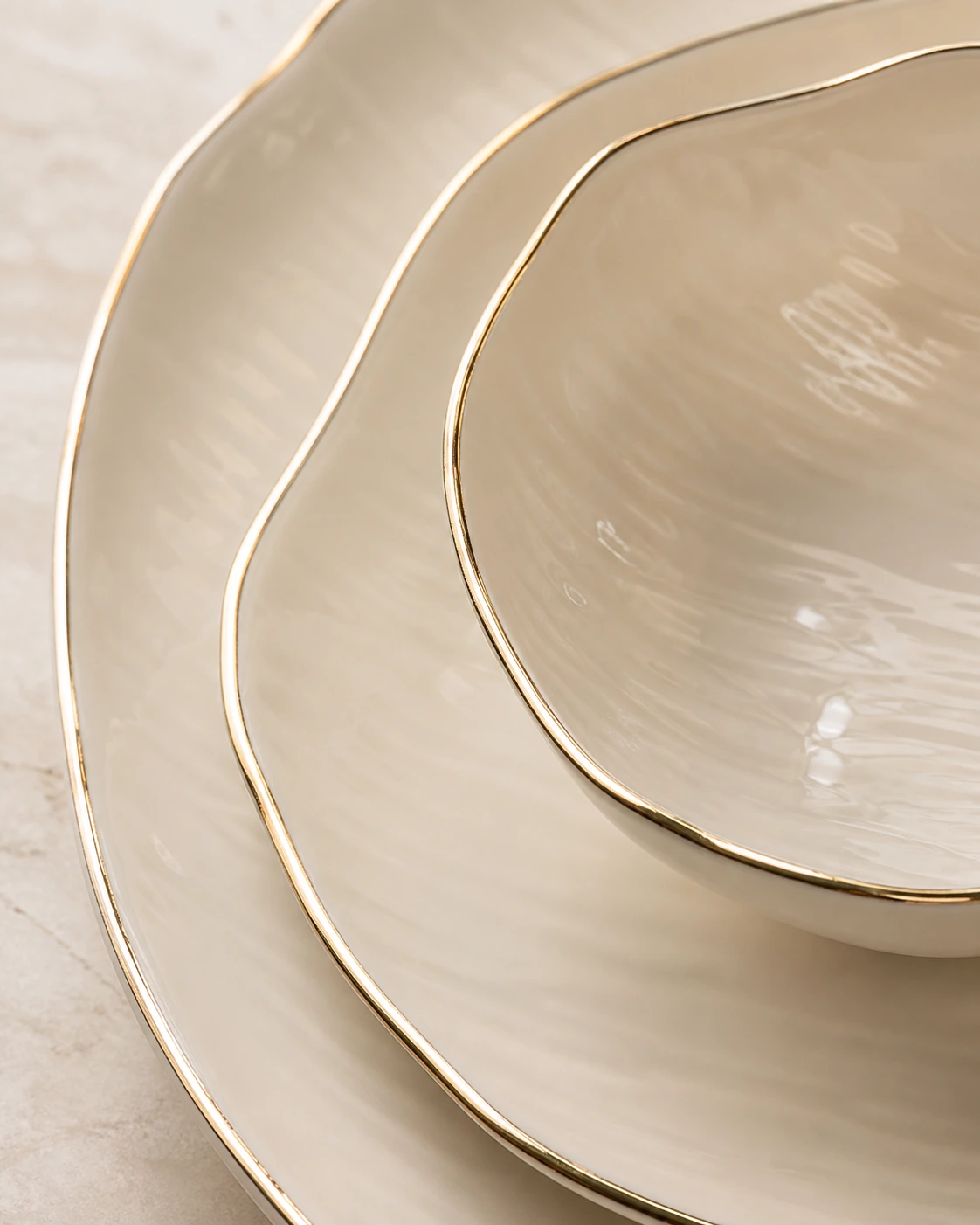 Close view of Ondine wavy edges, ripple texture and fine gold trim