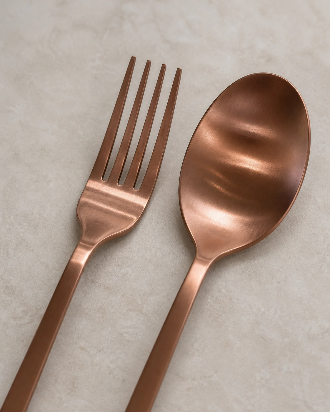 Close view of brushed rose bronze flatware finish