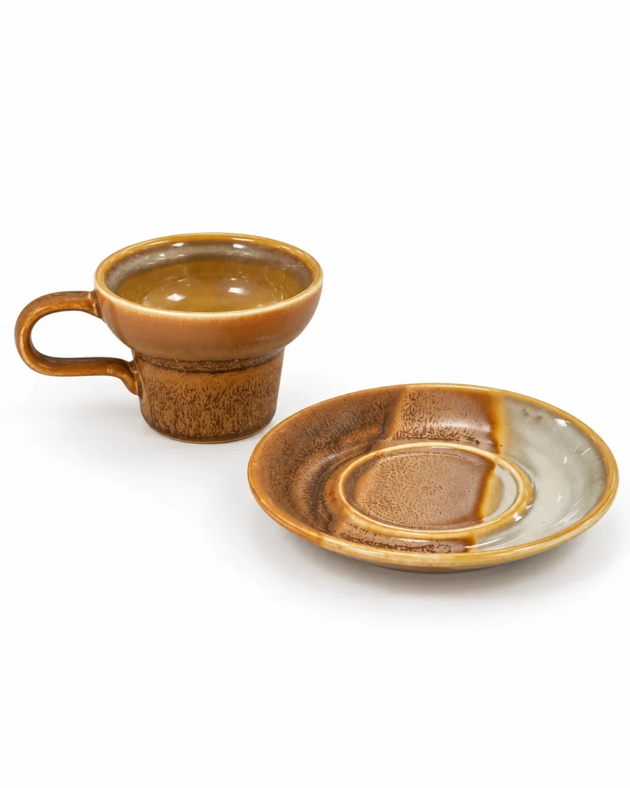 Amber porcelain cup and saucer with a glazed finish