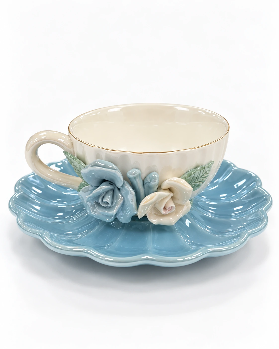 Porcelain cup and saucer with blue and ivory rose details and green leaves