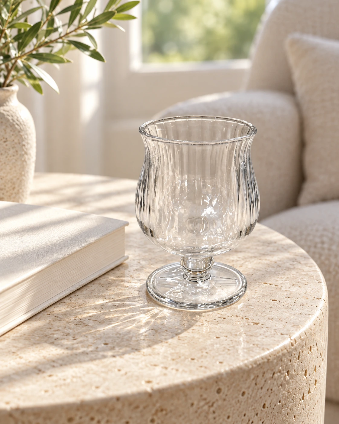 Clear glass goblet with a plain rim in a bright interior