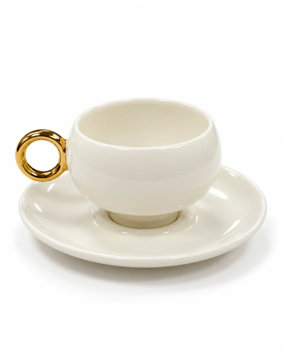 Ivory porcelain cup and saucer with a gold-coloured ring handle