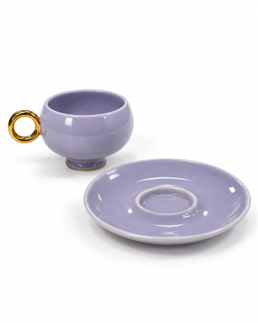 Violet porcelain cup and saucer with a gold-coloured ring handle